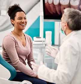 Young woman talking to sleep dentist 