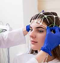 Woman getting set-up for a sleep test 