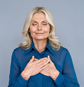 middle-aged woman smiling with relief 