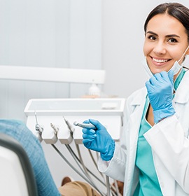 Dentist smiling at patient's dental exam