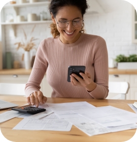 Woman in sweater looking at phone
