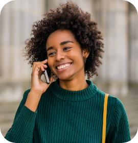 Person in sweater talking on phone